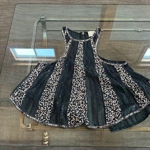 Tank top with sequins and leather